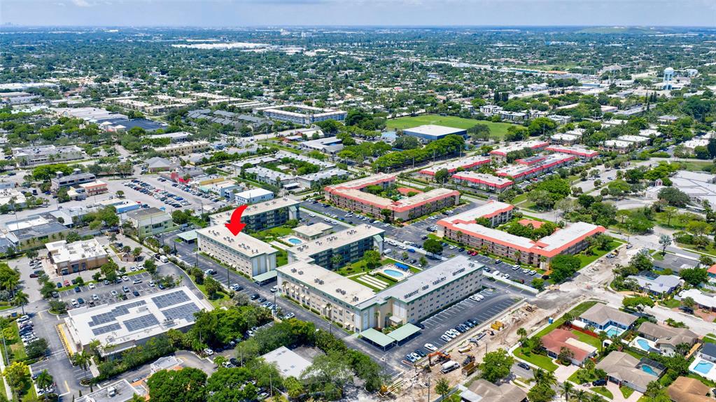 808 Southeast 7th Street, Unit 105B Deerfield Beach, FL 33441 - Photo 38 of 43 an aerial view of residential houses with outdoor space and parking