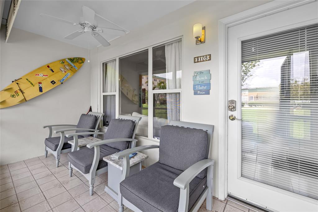 808 Southeast 7th Street, Unit 105B Deerfield Beach, FL 33441 - Photo 8 of 43 a dining room with furniture and wooden floor