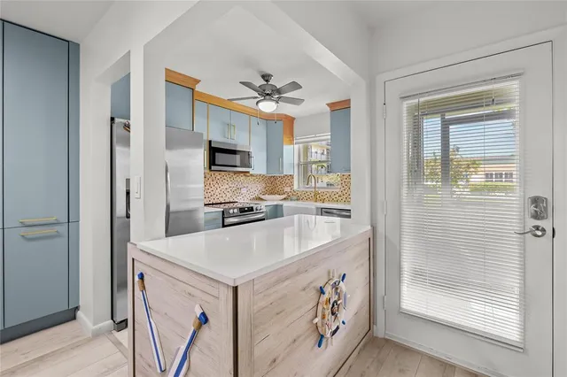 a living room with furniture a window and a flat screen tv