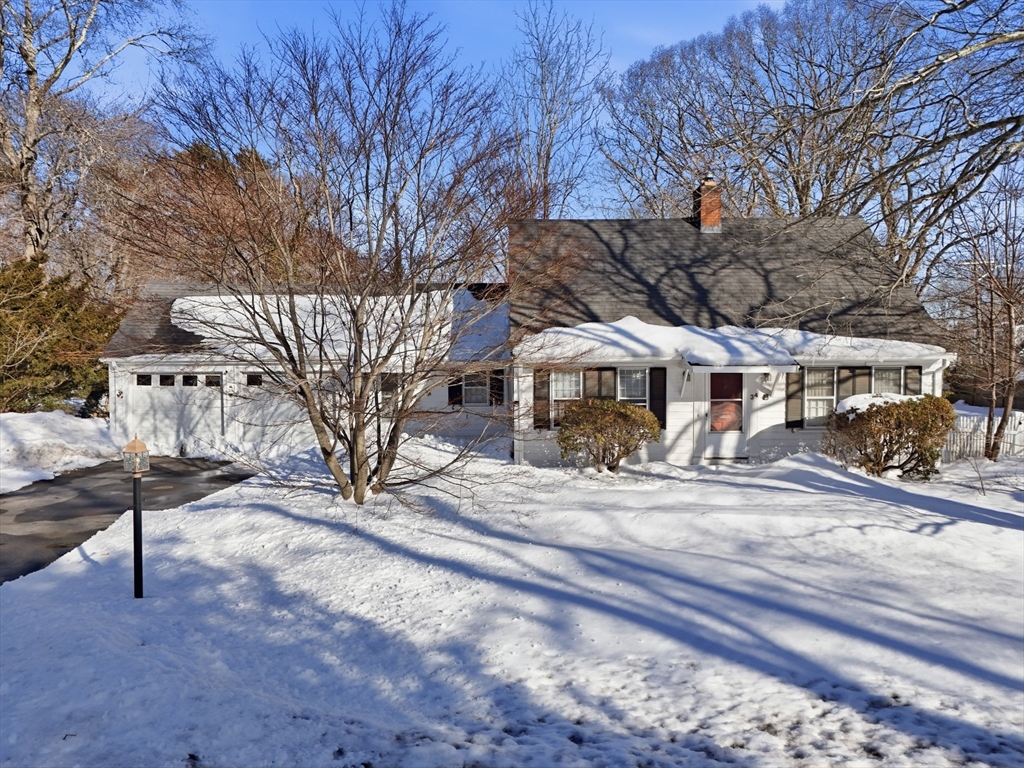 a view of a house with a yard covered with snow in the yard