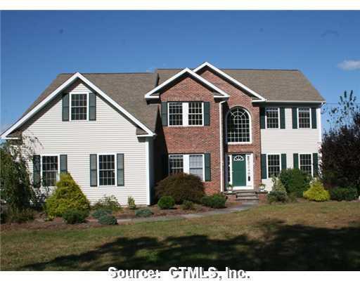 330 Falls Road Bethany, CT 06524 - Photo 1 of 1 a front view of a house with a yard
