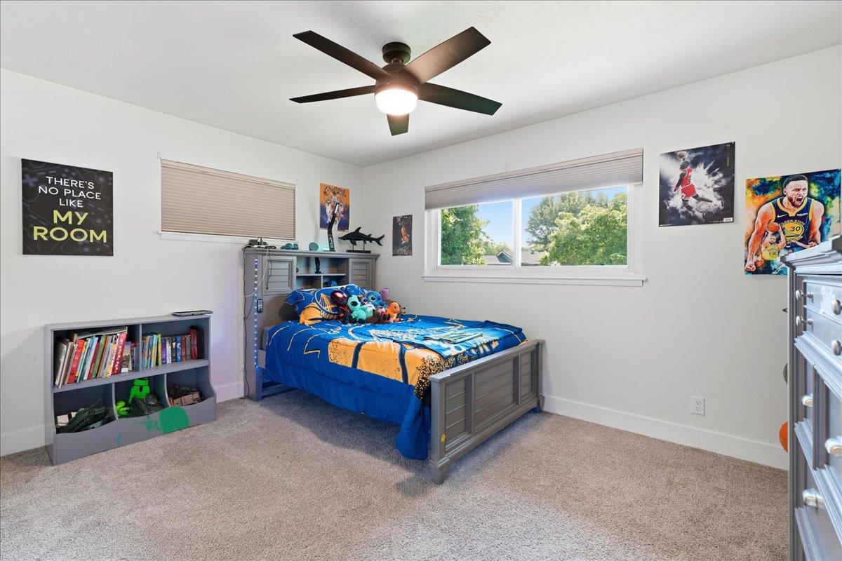 4849 Alexon Way Carmichael, CA 95608 - Photo 26 of 50 a living room with furniture and a book shelf