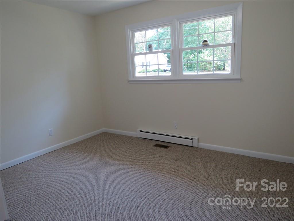 156 Eskimo Drive Bostic, NC 28018 - Photo 11 of 25 an empty room with a window