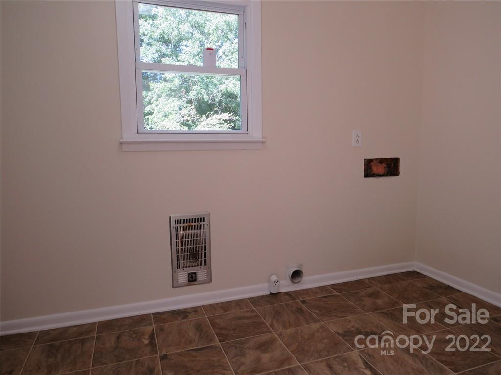 156 Eskimo Drive Bostic, NC 28018 - Photo 13 of 25 an empty room with a window