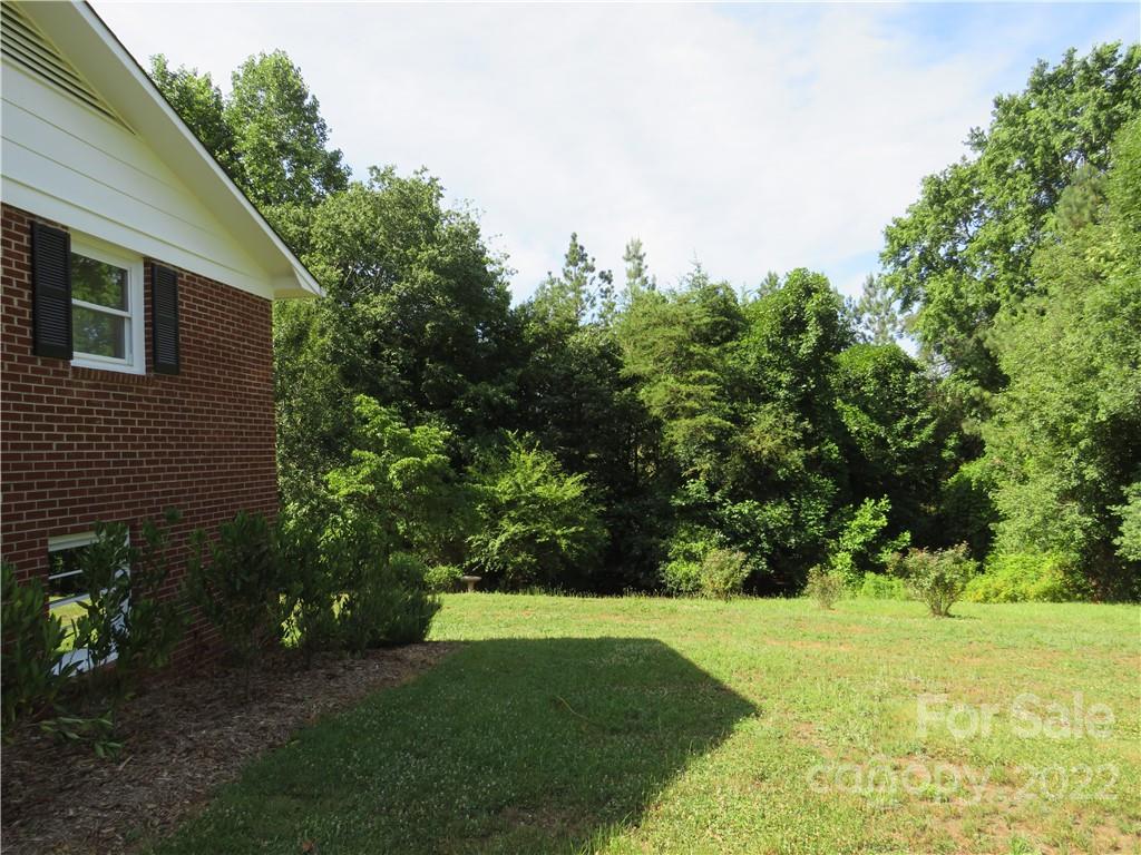 156 Eskimo Drive Bostic, NC 28018 - Photo 14 of 25 a view of a backyard with green space