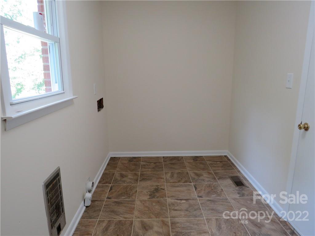 156 Eskimo Drive Bostic, NC 28018 - Photo 16 of 25 a view of a room with wooden floor and a window