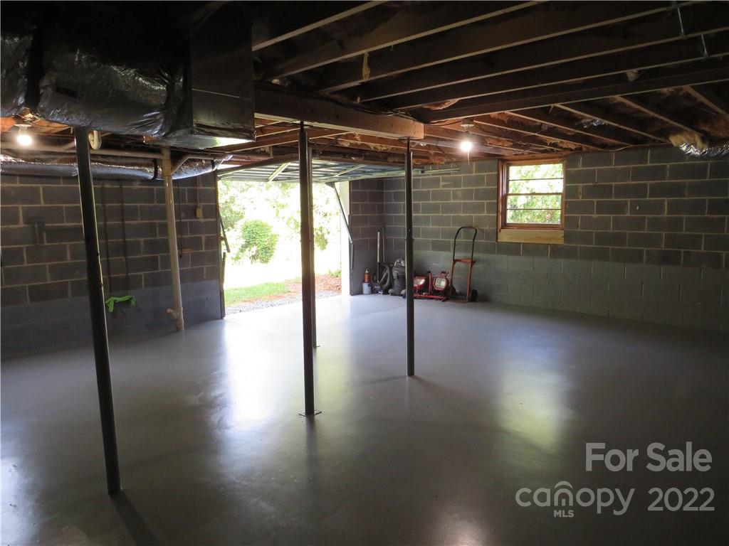 156 Eskimo Drive Bostic, NC 28018 - Photo 17 of 25 a view of water heater room with wooden floor