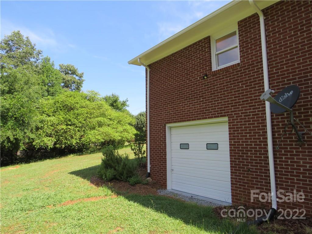156 Eskimo Drive Bostic, NC 28018 - Photo 21 of 25 a front view of a house with a yard