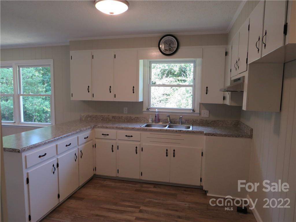 156 Eskimo Drive Bostic, NC 28018 - Photo 6 of 25 a kitchen with granite countertop a window a sink and a stove