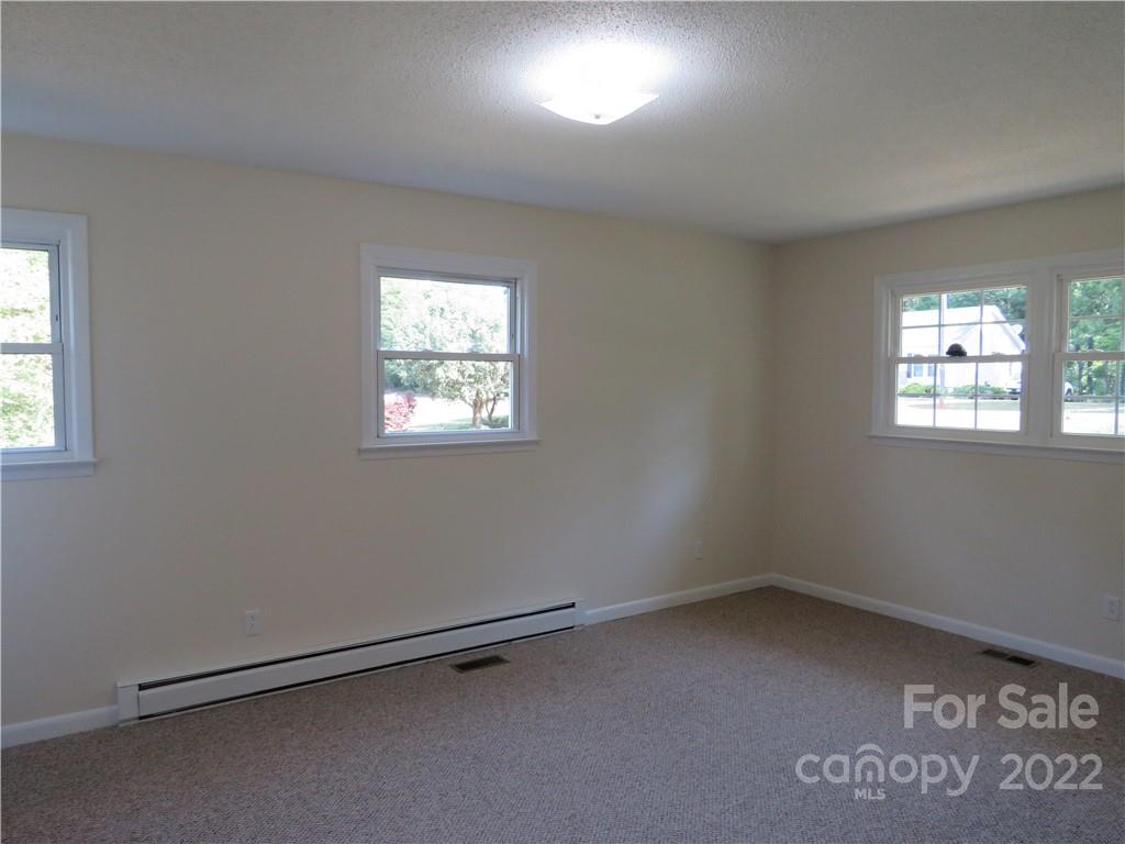 156 Eskimo Drive Bostic, NC 28018 - Photo 8 of 25 an empty room with windows