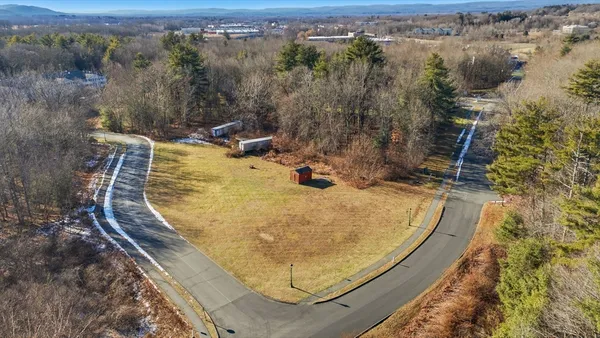 an aerial view of a house with swimming pool