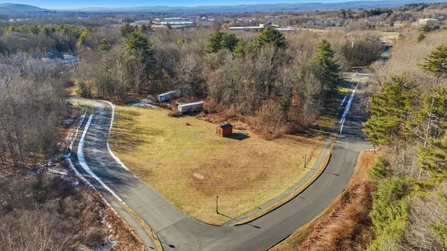an aerial view of a house with swimming pool