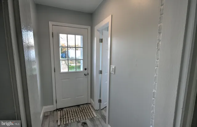 a view of a bathroom from a hallway