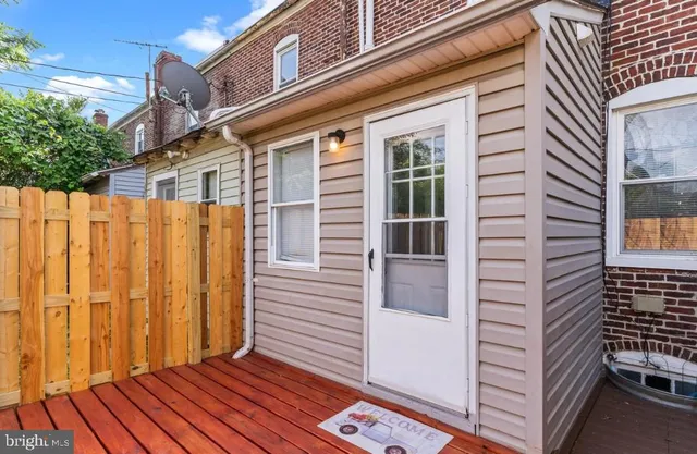 a view of a house with a door and wooden floor