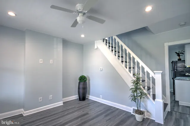 a view of an entryway with wooden floor