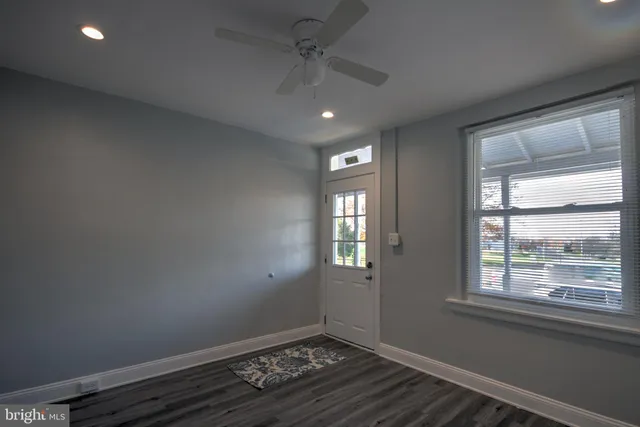 a view of an empty room with a window