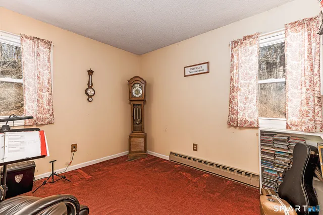 a view of a livingroom with an empty space and a window