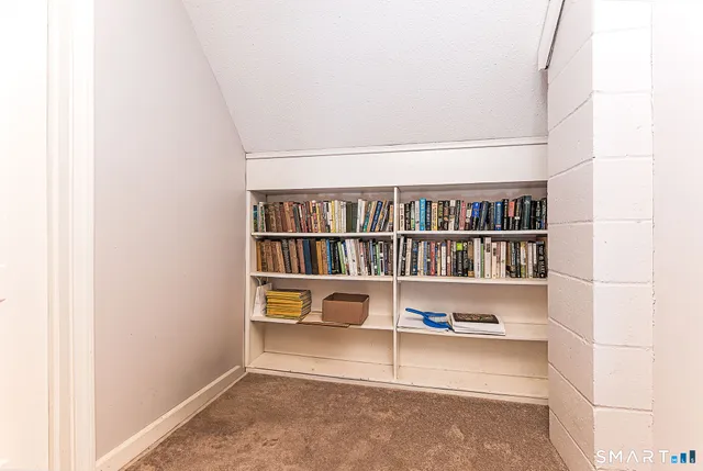 a living room with a book shelf
