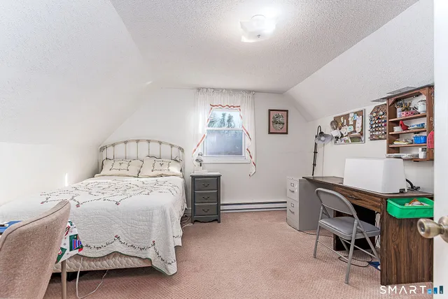 a bedroom with a bed and a cabinets