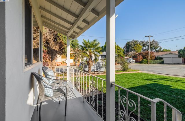 a view of a porch with seating space