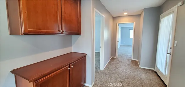 a view of cabinets and wooden floor