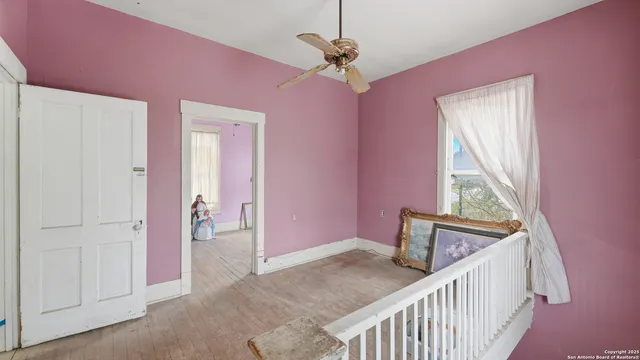 a view of a hallway with a bedroom