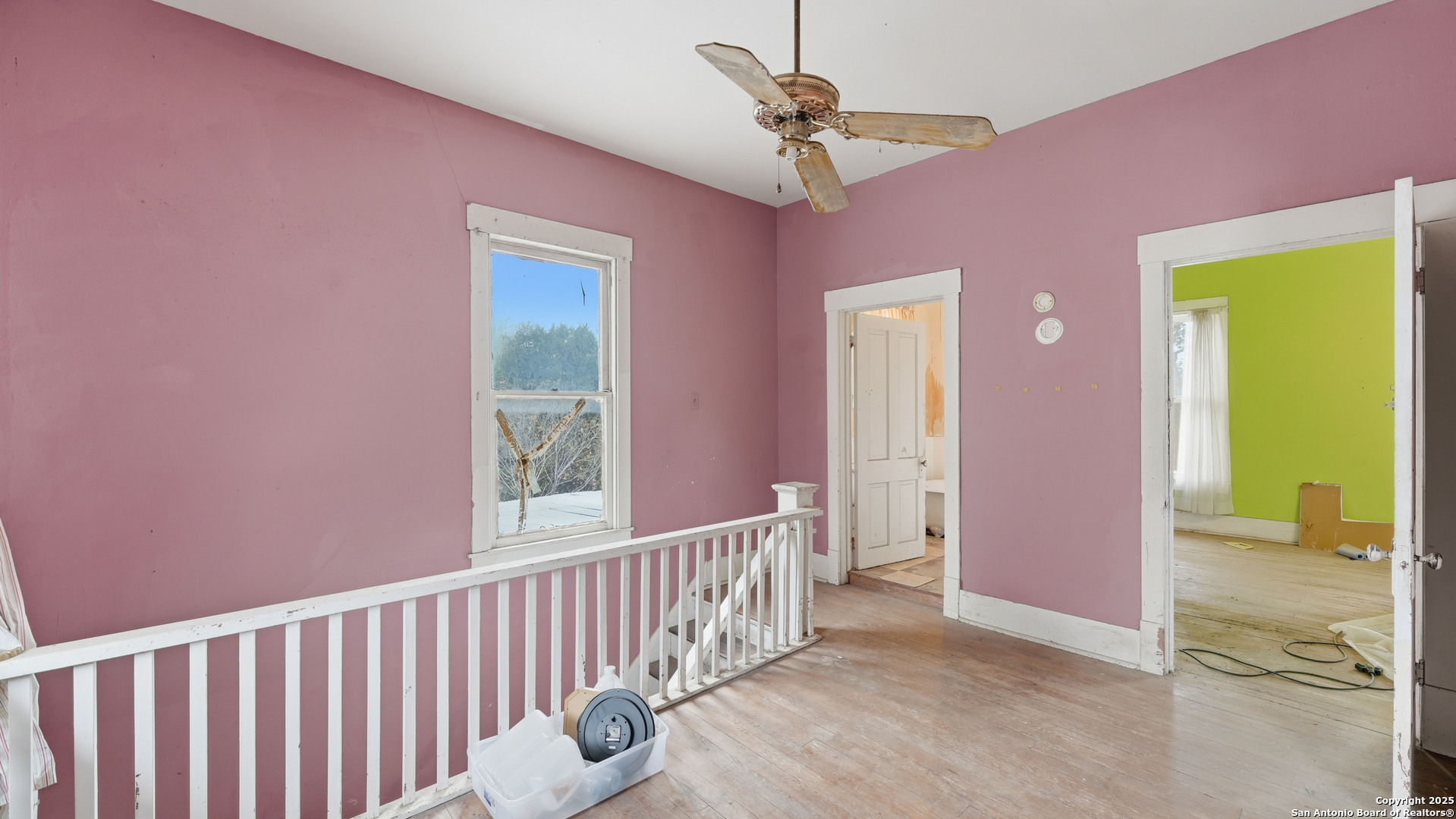 536 Commerce Street Pleasanton, TX 78064 - Photo 13 of 31 a view of a hallway with a bedroom