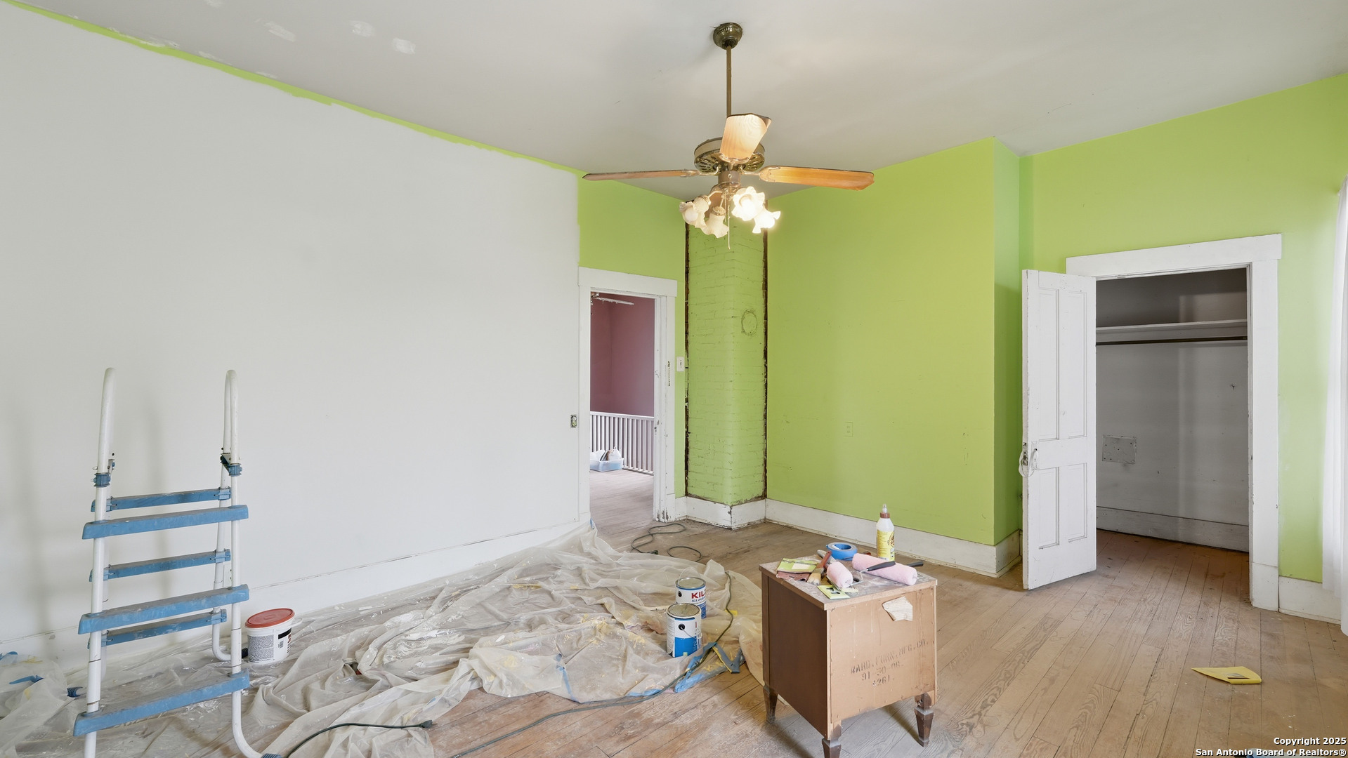 536 Commerce Street Pleasanton, TX 78064 - Photo 15 of 31 a bedroom with a bed and ceiling fan