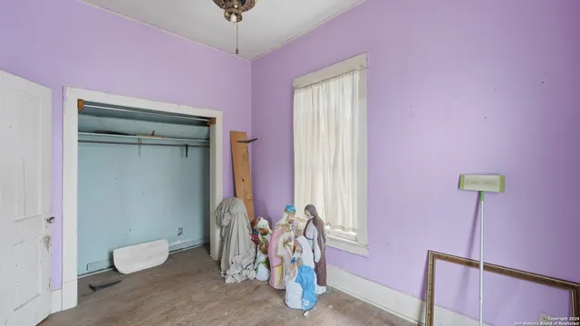 a bed room with a bed and a window