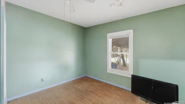 a bathroom with a toilet a sink and a mirror