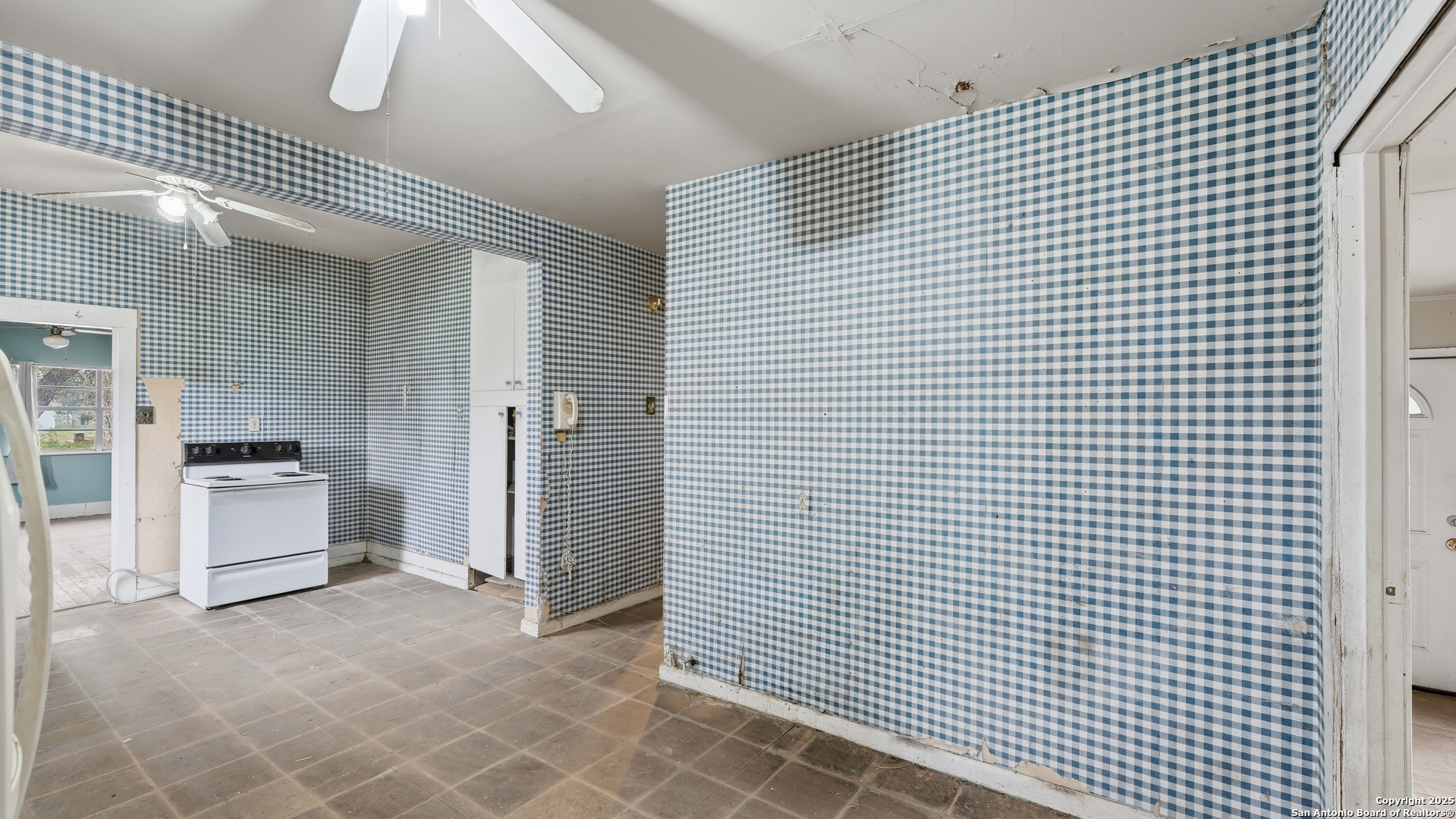536 Commerce Street Pleasanton, TX 78064 - Photo 24 of 31 a view of a refrigerator in kitchen and an empty room