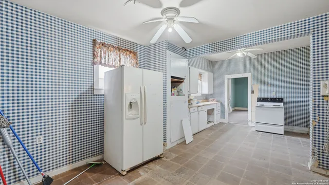 a kitchen with stainless steel appliances a refrigerator and a stove