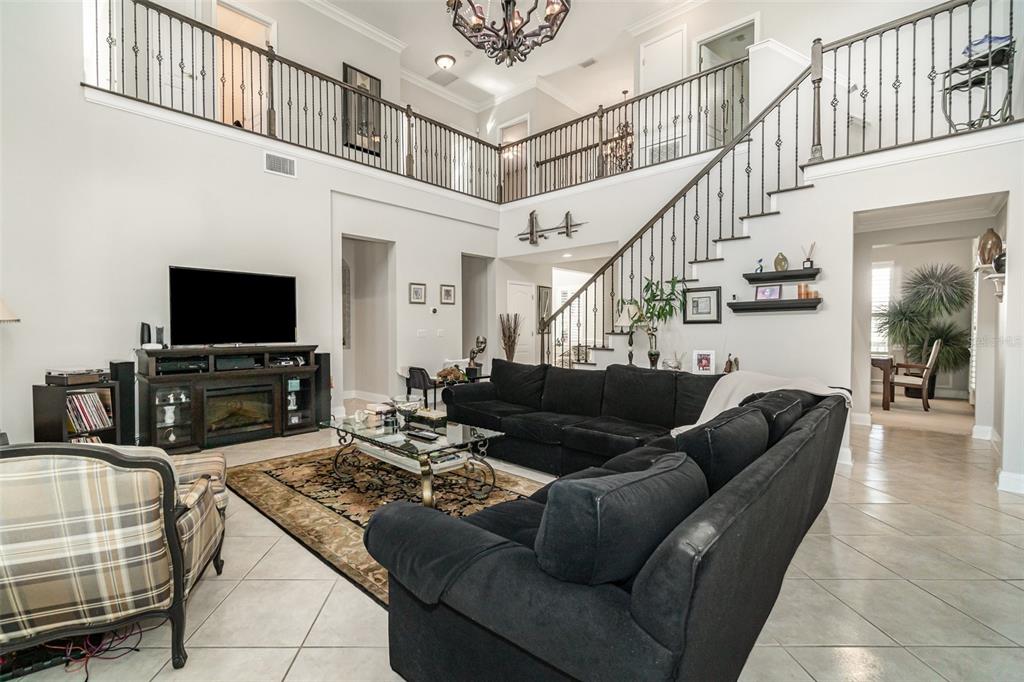6905 Nobleton Drive Windermere, FL 34786 - Photo 12 of 41 a living room with furniture and a flat screen tv