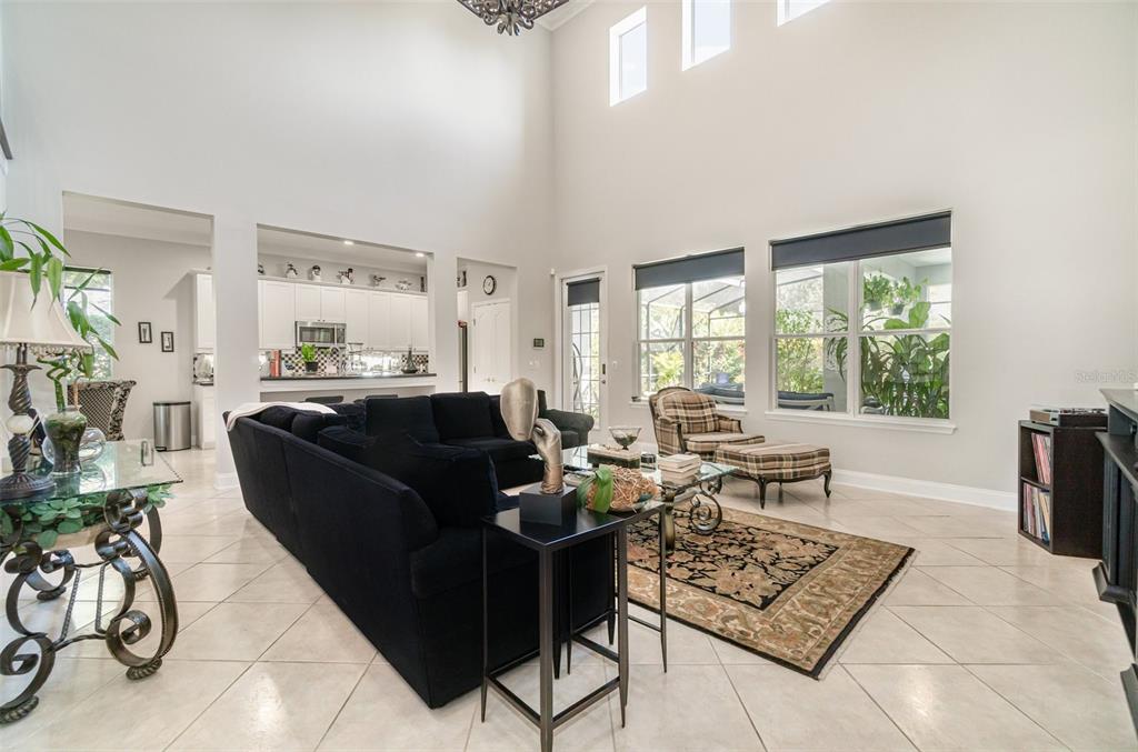 6905 Nobleton Drive Windermere, FL 34786 - Photo 13 of 41 a living room with furniture a table and a large window