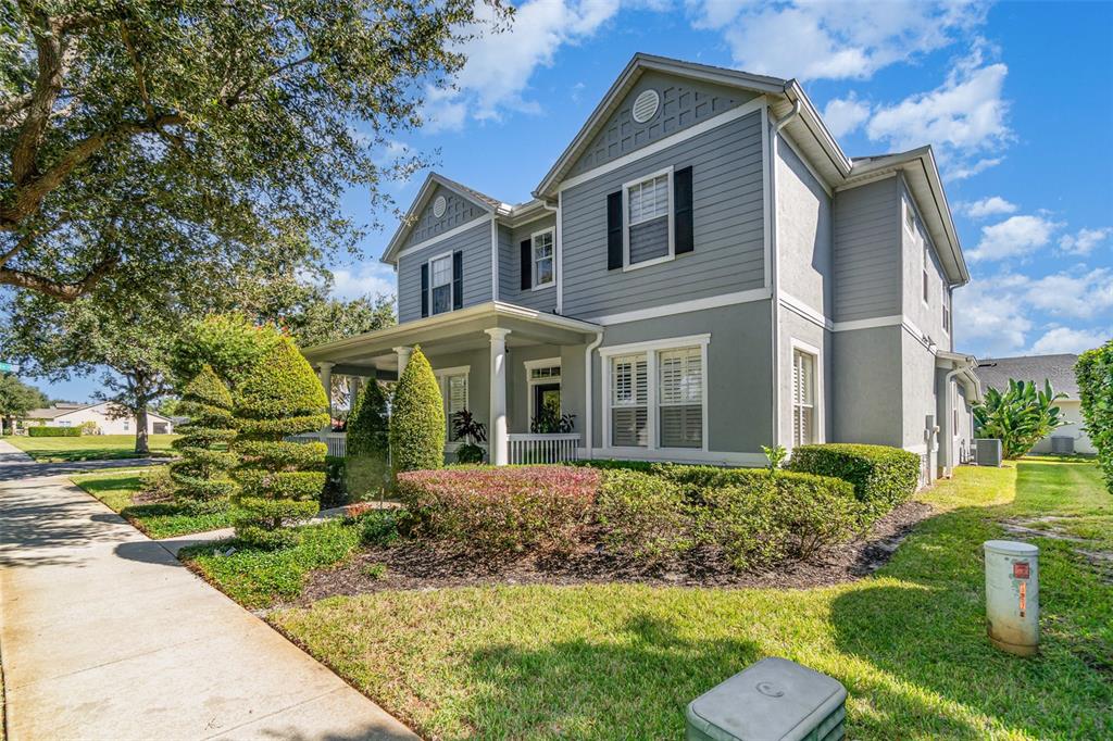 6905 Nobleton Drive Windermere, FL 34786 - Photo 2 of 41 a front view of a house with garden
