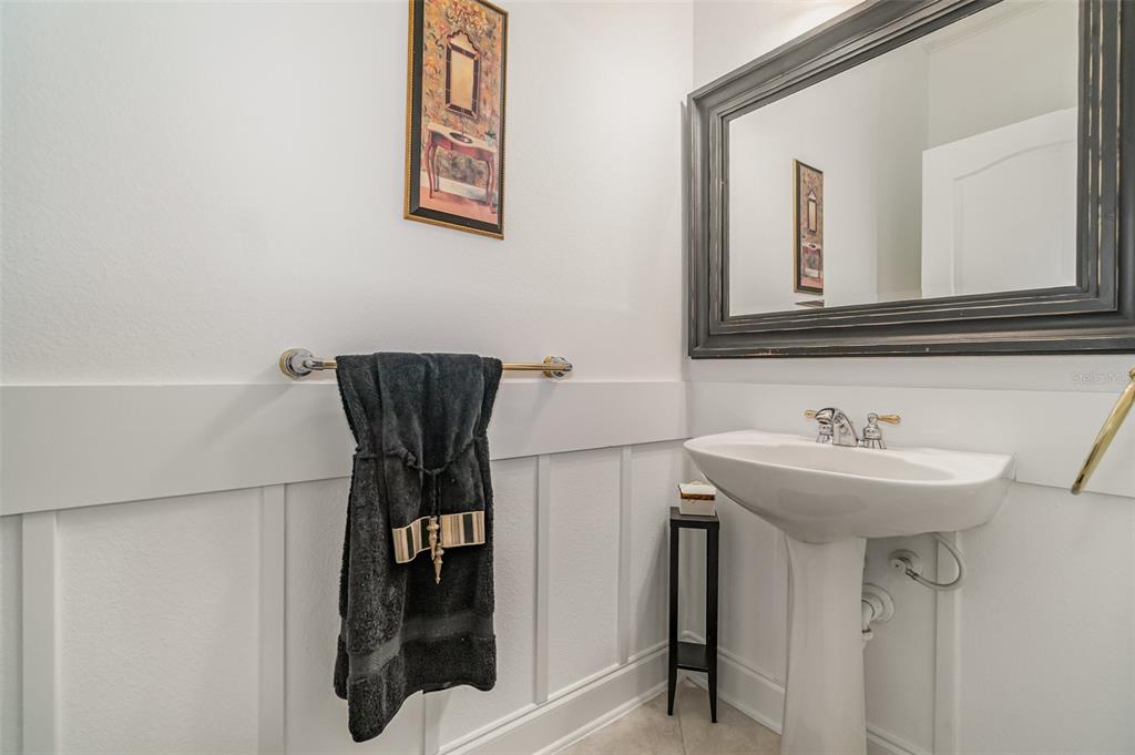 6905 Nobleton Drive Windermere, FL 34786 - Photo 22 of 41 a bathroom with a sink and a mirror