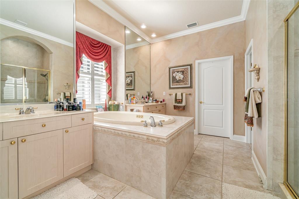 6905 Nobleton Drive Windermere, FL 34786 - Photo 25 of 41 a spacious bathroom with a sink and a mirror
