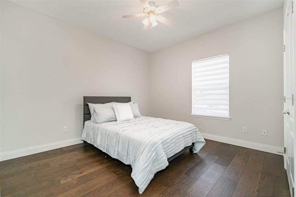 6905 Nobleton Drive Windermere, FL 34786 - Photo 28 of 41 a large bed sitting in a bedroom next to a window