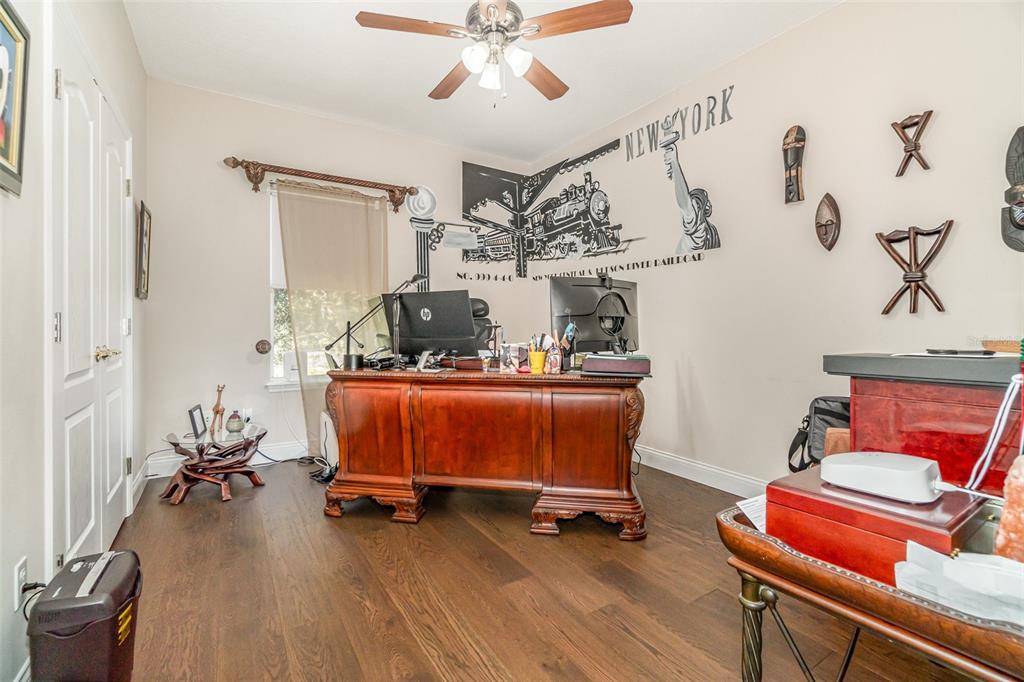 6905 Nobleton Drive Windermere, FL 34786 - Photo 29 of 41 a living room with furniture and wooden floor