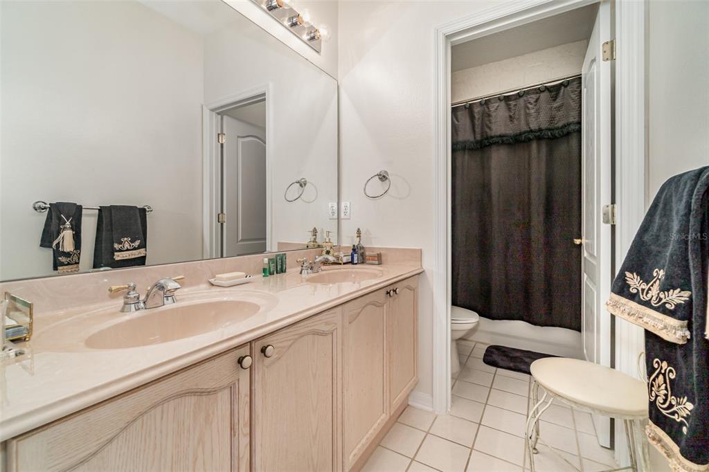 6905 Nobleton Drive Windermere, FL 34786 - Photo 31 of 41 a bathroom with a sink a toilet and mirror