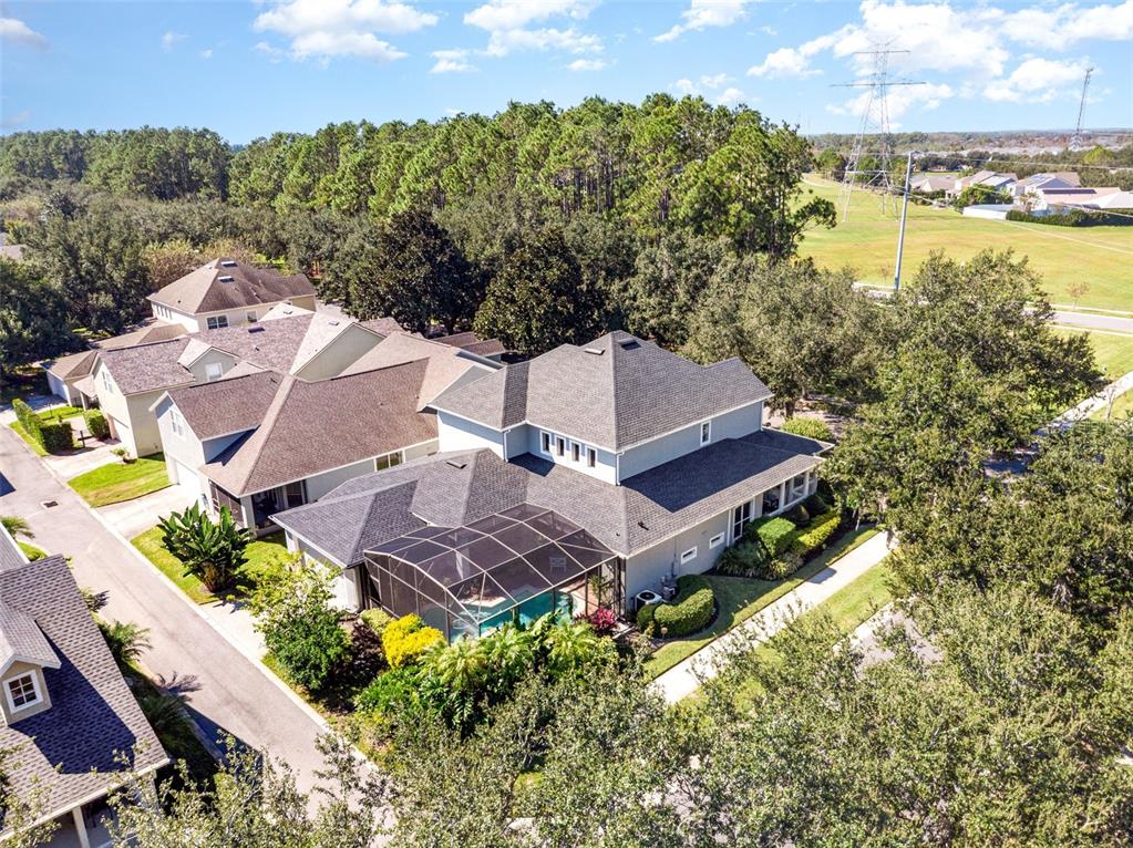 6905 Nobleton Drive Windermere, FL 34786 - Photo 38 of 41 an aerial view of a house with a garden and lake view