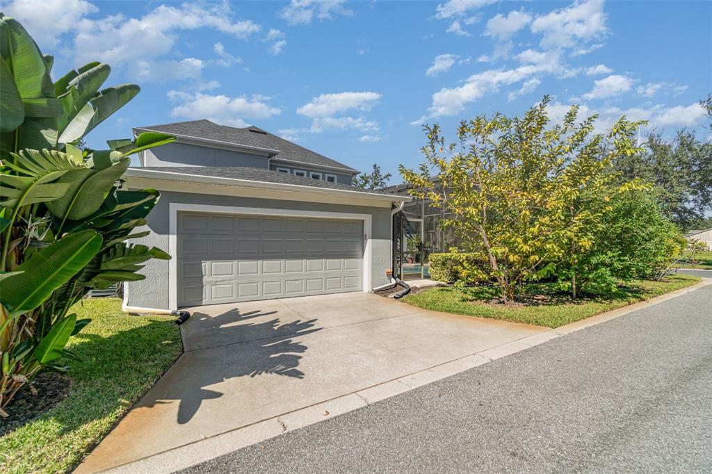 6905 Nobleton Drive Windermere, FL 34786 - Photo 6 of 41 a front view of a house with a yard and garage