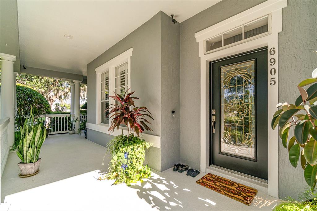 6905 Nobleton Drive Windermere, FL 34786 - Photo 8 of 41 a front view of a house with a yard