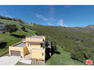 a view of a city from a big yard