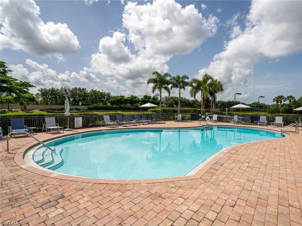 26502 Lucky Stone Road, Unit 101 Bonita Springs, FL 34135 - Photo 39 of 40 Community pool featuring a patio area