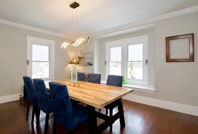 a view of a dining room with furniture and window