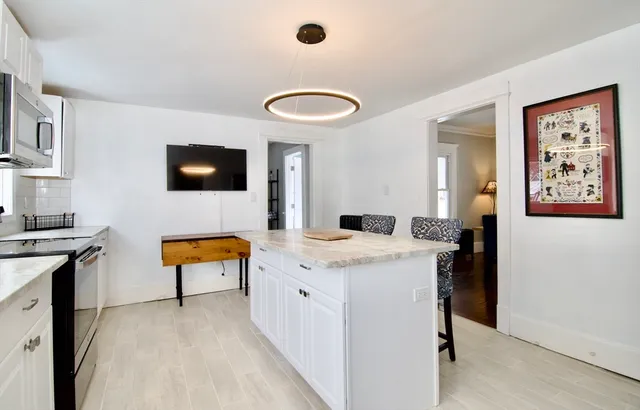 a view of a living room and a flat screen tv