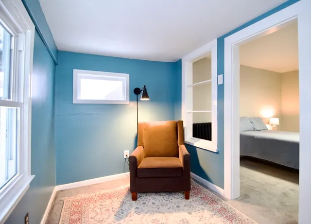 a bedroom with a bed and a couch