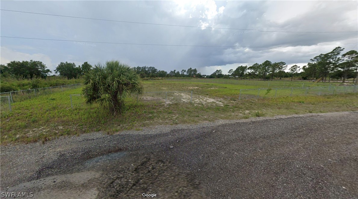 7537 3rd Place LaBelle, FL 33935 - Photo 2 of 9 a view of a lake with a big yard