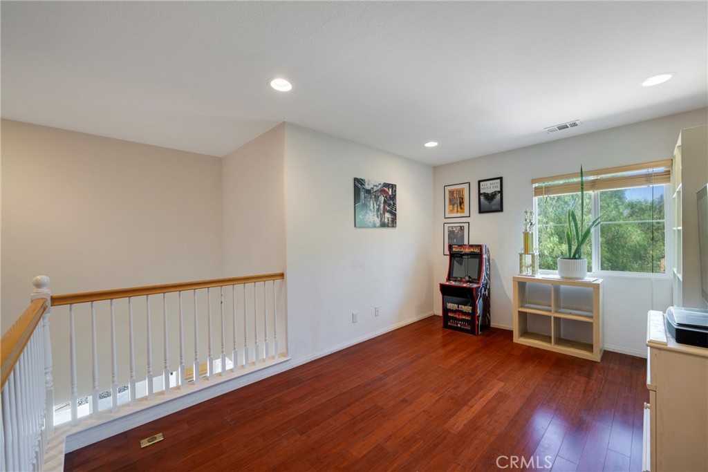 3819 St Austell Way Perris, CA 92571 - Photo 24 of 64 a view of a livingroom with furniture and wooden floor